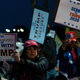 A group of unmasked protestors gather outside Walter Reed medical center to wish Donald Trump well, because nothing makes sense in this idiocracy anymore.